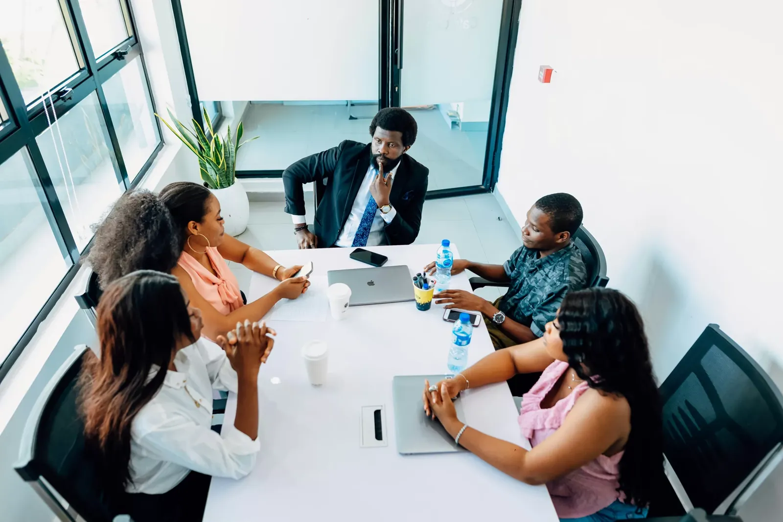 A team of business owners and their advisor reviewing results together